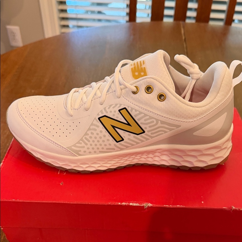 New Balance White Velo 2 White and Gold Women’s softball turf shoes